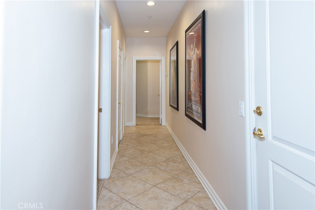 7361 Via Vista Riverside, CA 92506 - Photo 21 of 34 a view of a hallway with wooden shelves
