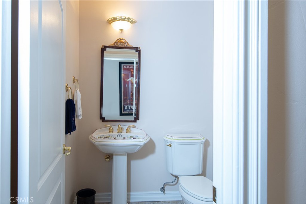 7361 Via Vista Riverside, CA 92506 - Photo 22 of 34 a bathroom with a toilet sink and mirror