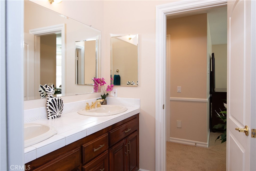 7361 Via Vista Riverside, CA 92506 - Photo 27 of 34 a bathroom with a sink and a mirror