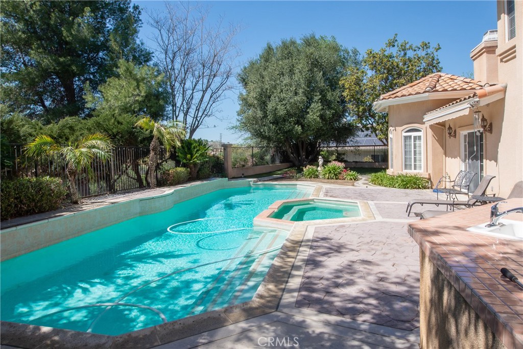 7361 Via Vista Riverside, CA 92506 - Photo 29 of 34 a view of a house with swimming pool and a yard