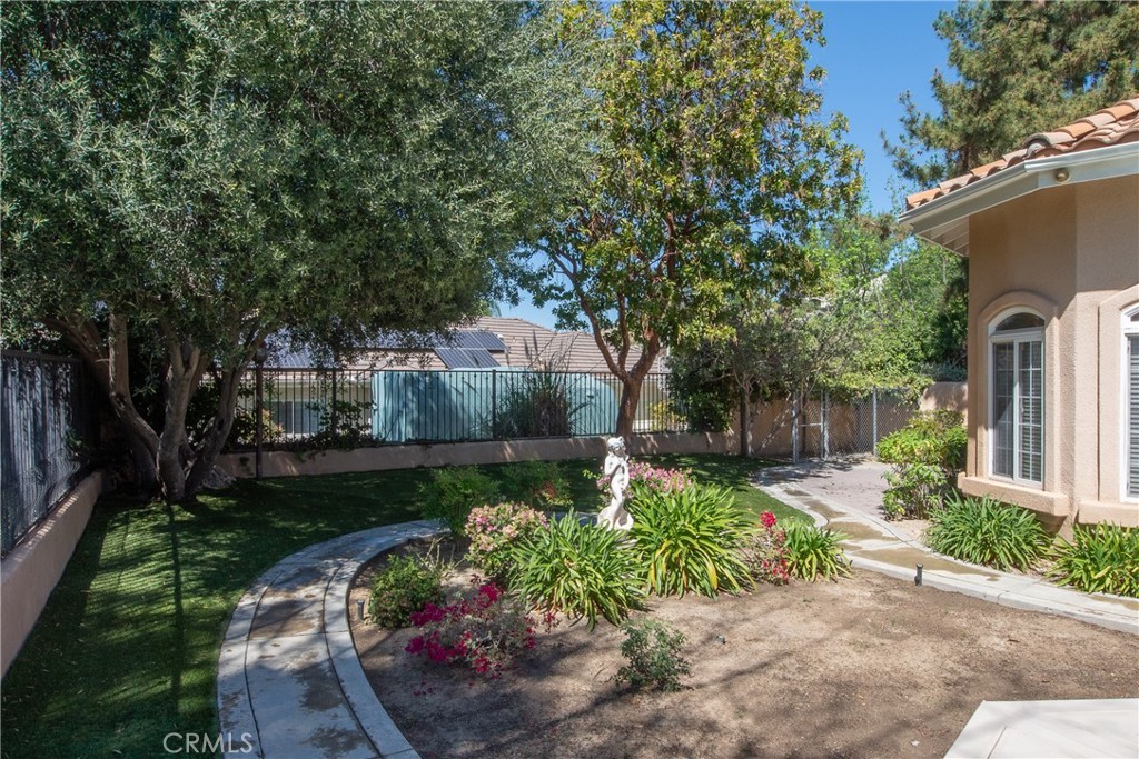 7361 Via Vista Riverside, CA 92506 - Photo 30 of 34 a front view of a house with a yard and a garden