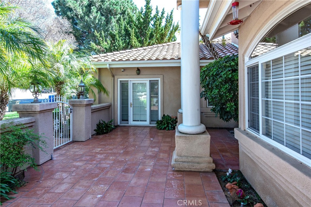 7361 Via Vista Riverside, CA 92506 - Photo 3 of 34 a view of a house with potted plants and a fountain