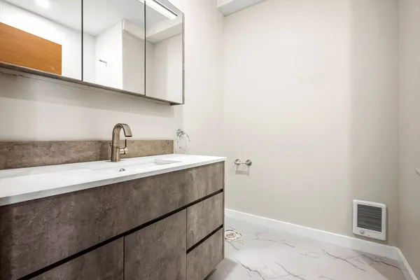a kitchen with a sink and cabinets