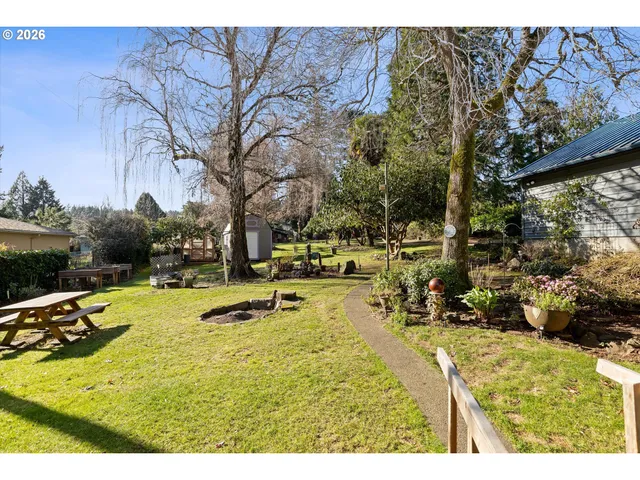 a swimming pool with trees in the background