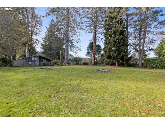 a view of a tree in front of a house