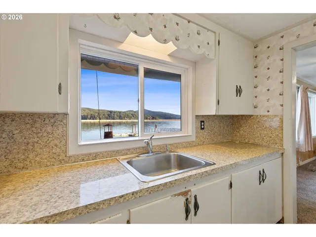 a kitchen with granite countertop a sink and a granite top