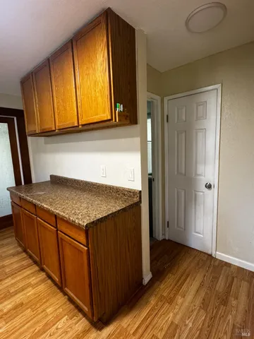 a kitchen with stainless steel appliances granite countertop wooden cabinets a sink and dishwasher