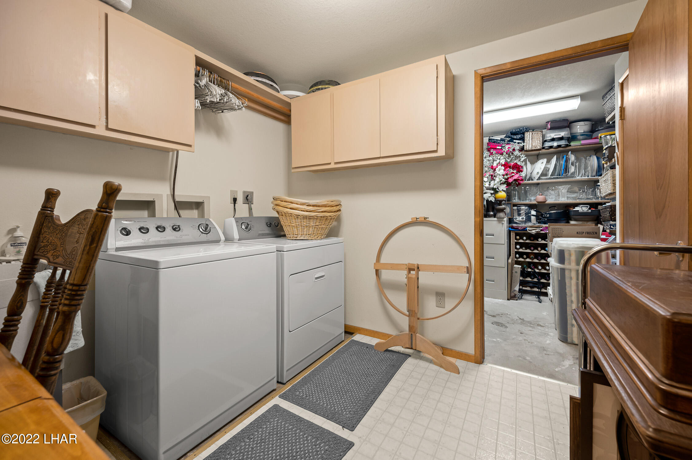 6712 Flag Mine Road Kingman, AZ 86401 - Photo 46 of 72 Laundry room with laundry sink and built in cabinetry. Followed by wine cellar.