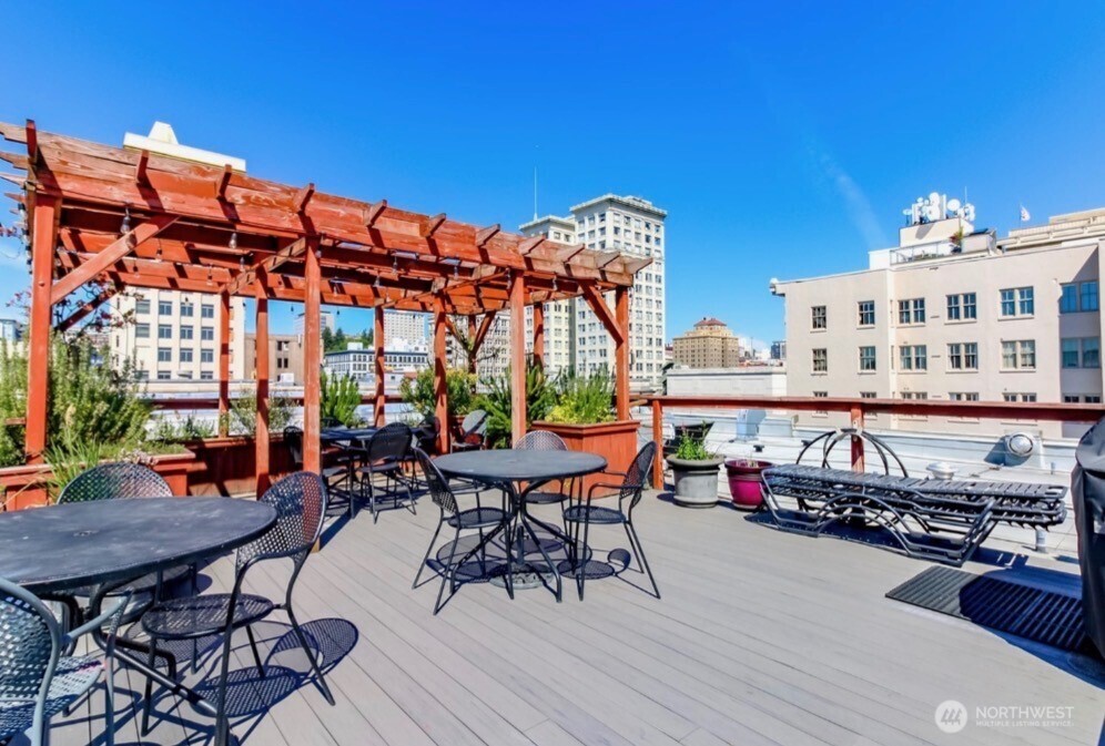1120 Cliff Street, Unit 211 Tacoma, WA 98402 - Photo 12 of 20 a patio with hardwood table and chairs