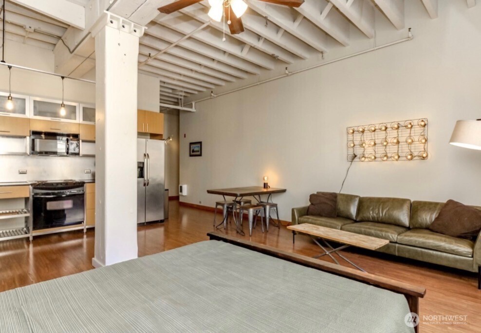 1120 Cliff Street, Unit 211 Tacoma, WA 98402 - Photo 5 of 20 a living room with furniture and kitchen view