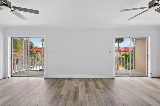 a view of an empty room with a window