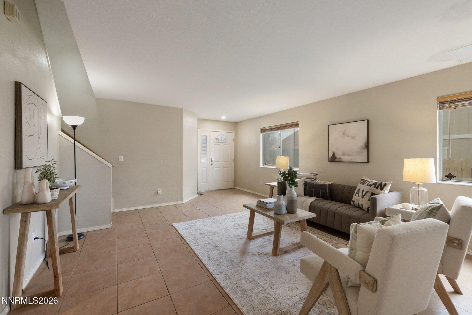 8486 Piper Place Reno, NV 89506 - Photo 4 of 80 a living room with furniture and a wooden floor