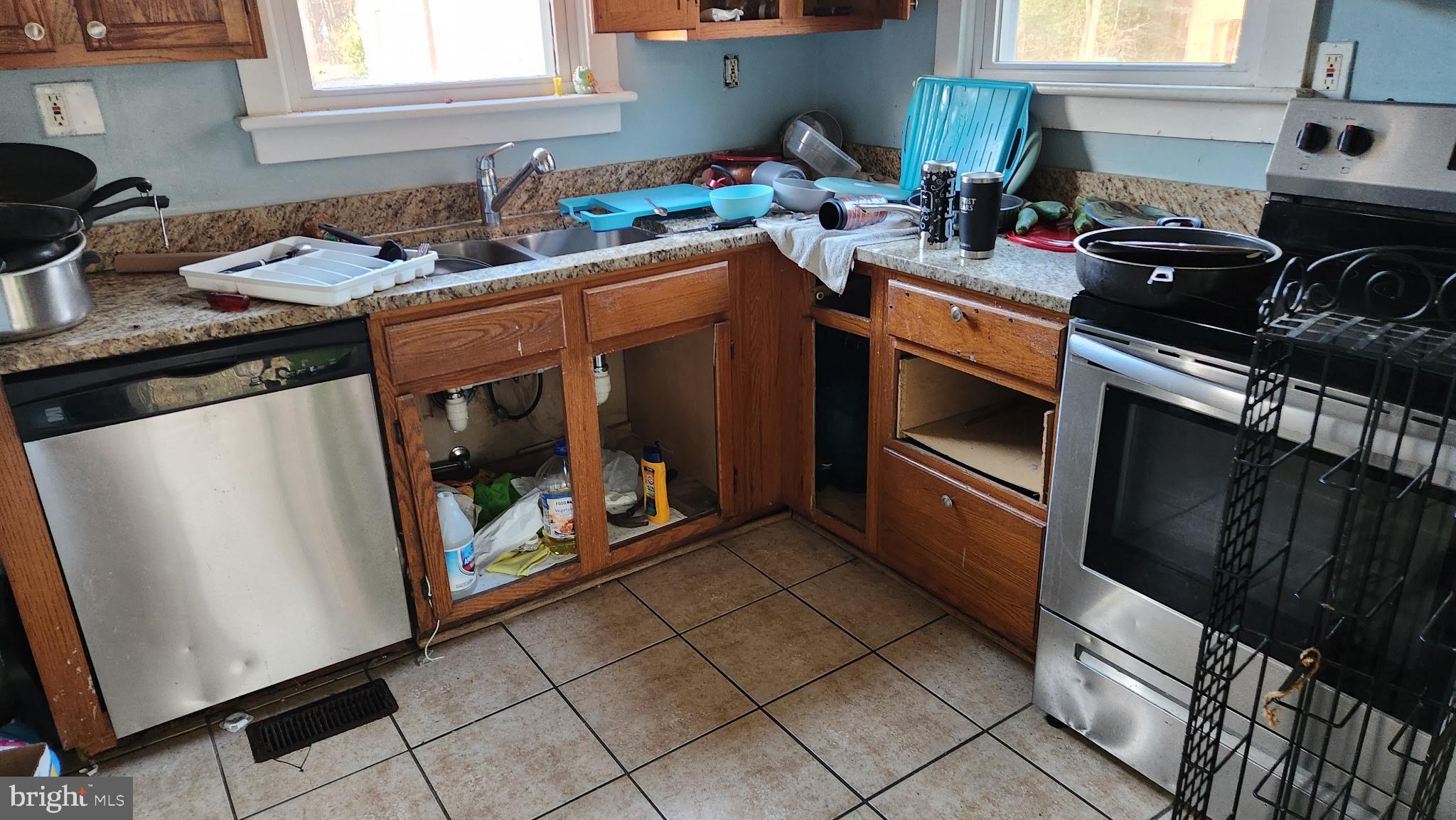 14130 Chotank Loop King George, VA 22485 - Photo 3 of 17 a kitchen with a stove sink and cabinets