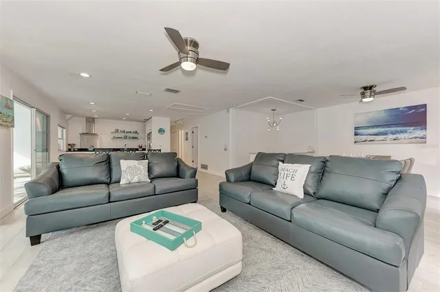 a view of a dining room with furniture and a kitchen
