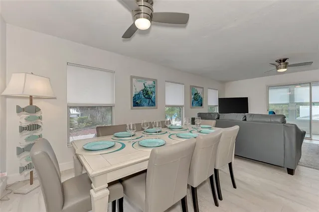 a large kitchen with granite countertop a counter top space and stainless steel appliances