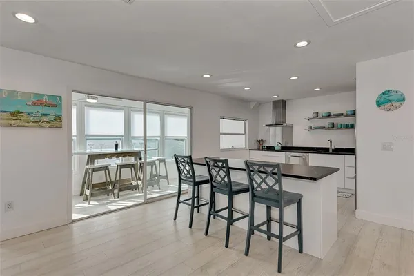 a kitchen with counter top space a sink cabinets and appliances