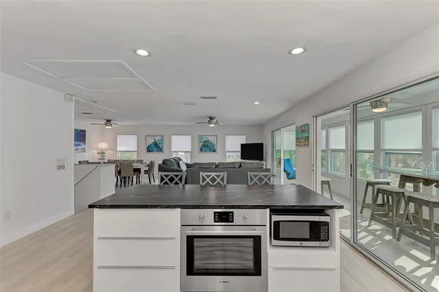 a bedroom with a bed and a flat screen tv on the dresser