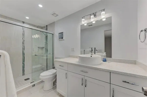 a bathroom with a bathtub and shower