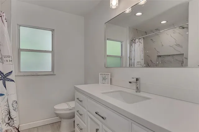 a view of balcony with wooden floor and fence