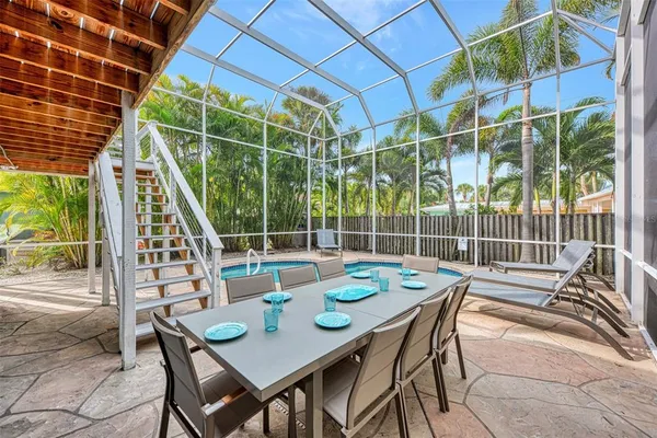 a view of a house with outdoor space and sitting area