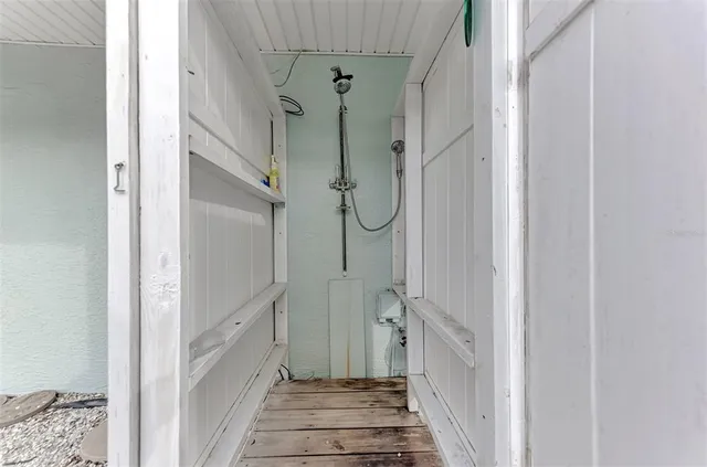 a view of a house with a porch and furniture