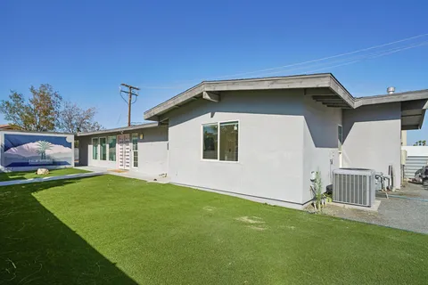 a house view with a garden space