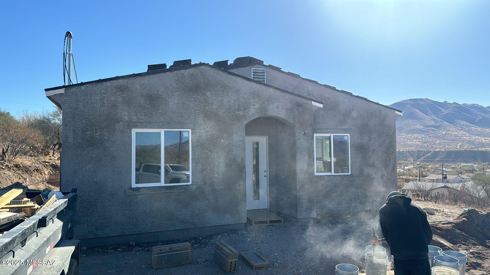 1885 Via Ochoa Rio Rico, AZ 85648 - Photo 10 of 11 a front view of a house with a yard
