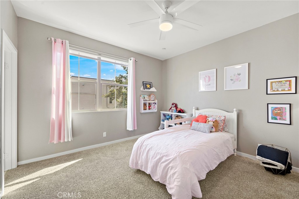 144 Paramount Irvine, CA 92618 - Photo 18 of 43 a bed sitting in a bedroom next to a window
