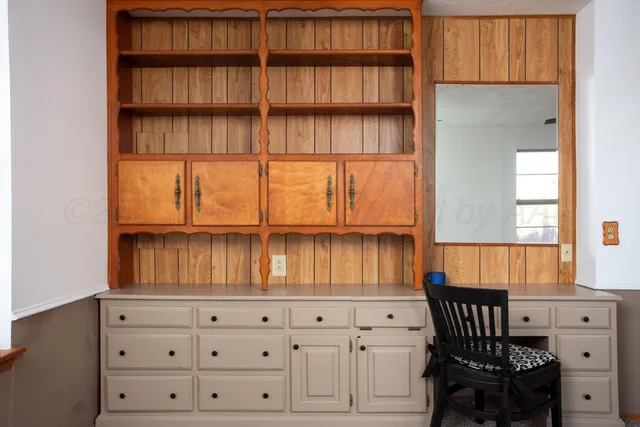 a view of a livingroom with furniture and chandelier
