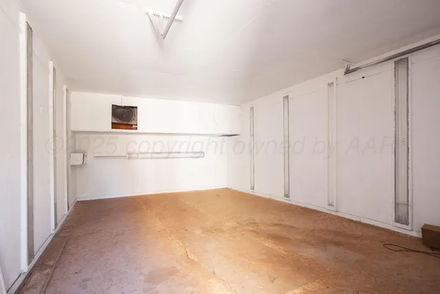 an aerial view of house with yard