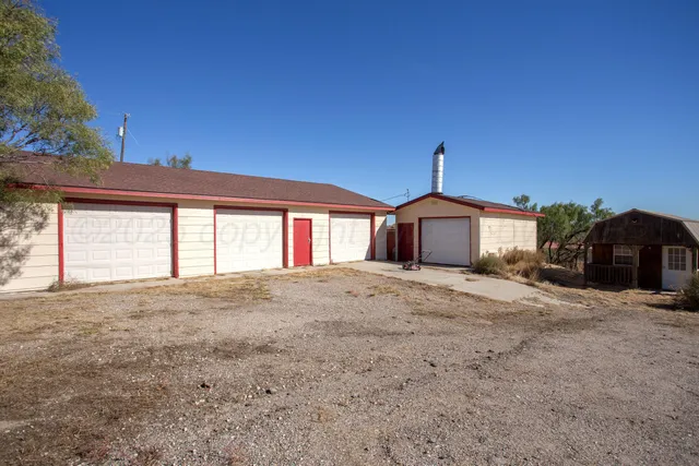 an aerial view of house with yard