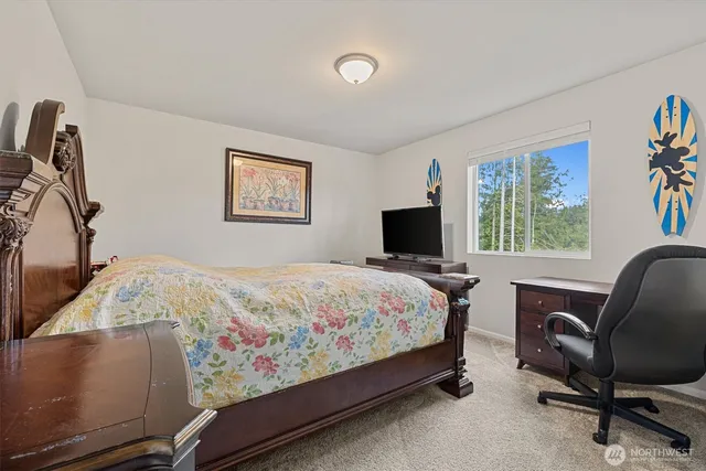 a bedroom with bed and a window