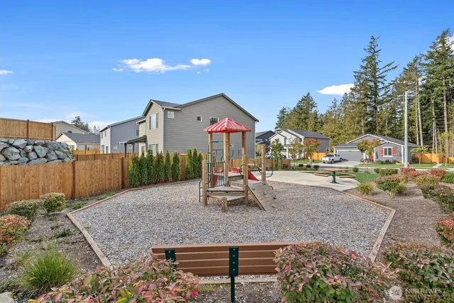 a view of a park with swings and slides