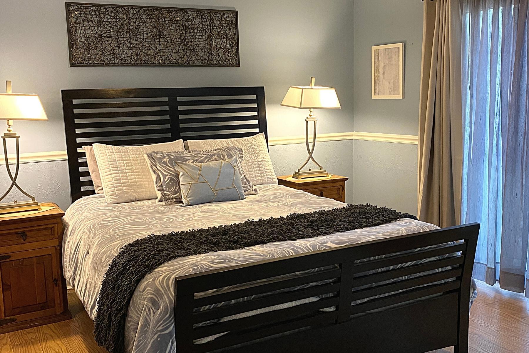 300 Buck Island Road, Unit 7B West Yarmouth, MA 02673 - Photo 14 of 22 a bedroom with a bed and a night stand