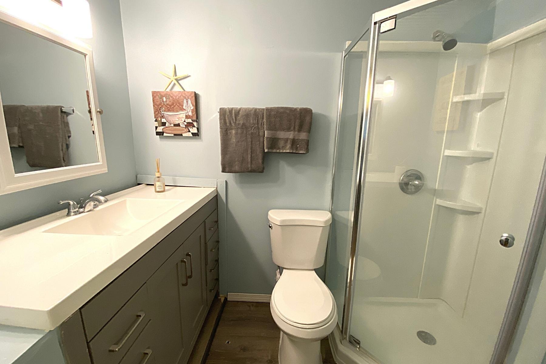 300 Buck Island Road, Unit 7B West Yarmouth, MA 02673 - Photo 15 of 22 a bathroom with a sink toilet and shower