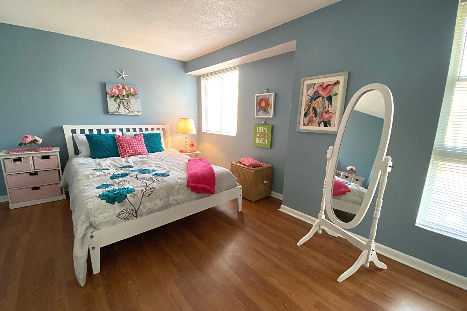 300 Buck Island Road, Unit 7B West Yarmouth, MA 02673 - Photo 16 of 22 a bedroom with a bed and wooden floor