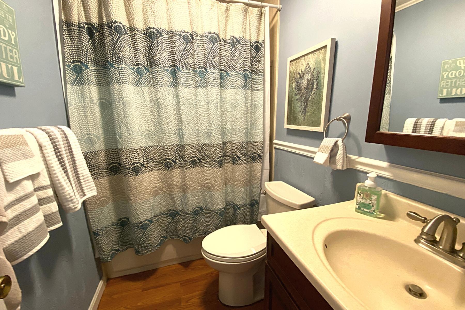 300 Buck Island Road, Unit 7B West Yarmouth, MA 02673 - Photo 17 of 22 a bathroom with a sink toilet and shower