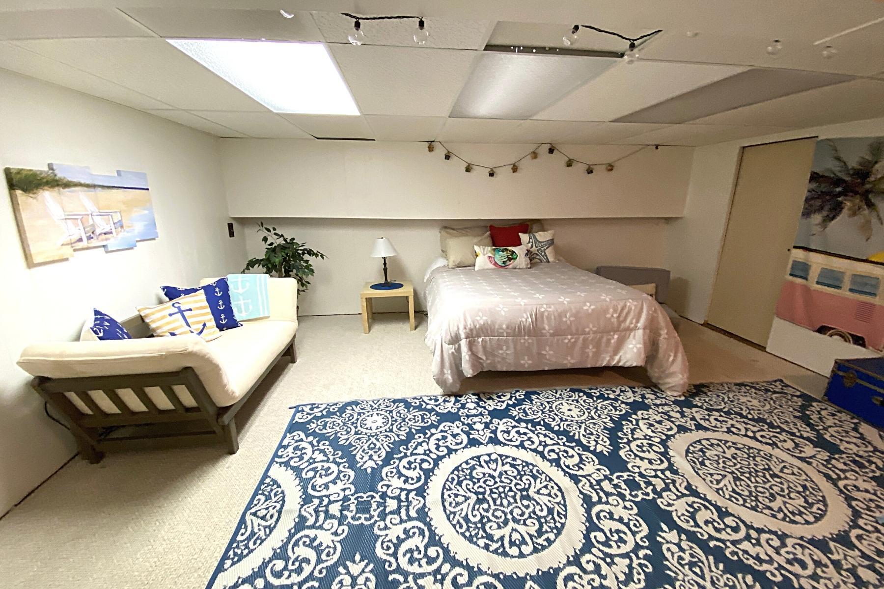 300 Buck Island Road, Unit 7B West Yarmouth, MA 02673 - Photo 18 of 22 a bedroom with a bed and a couch