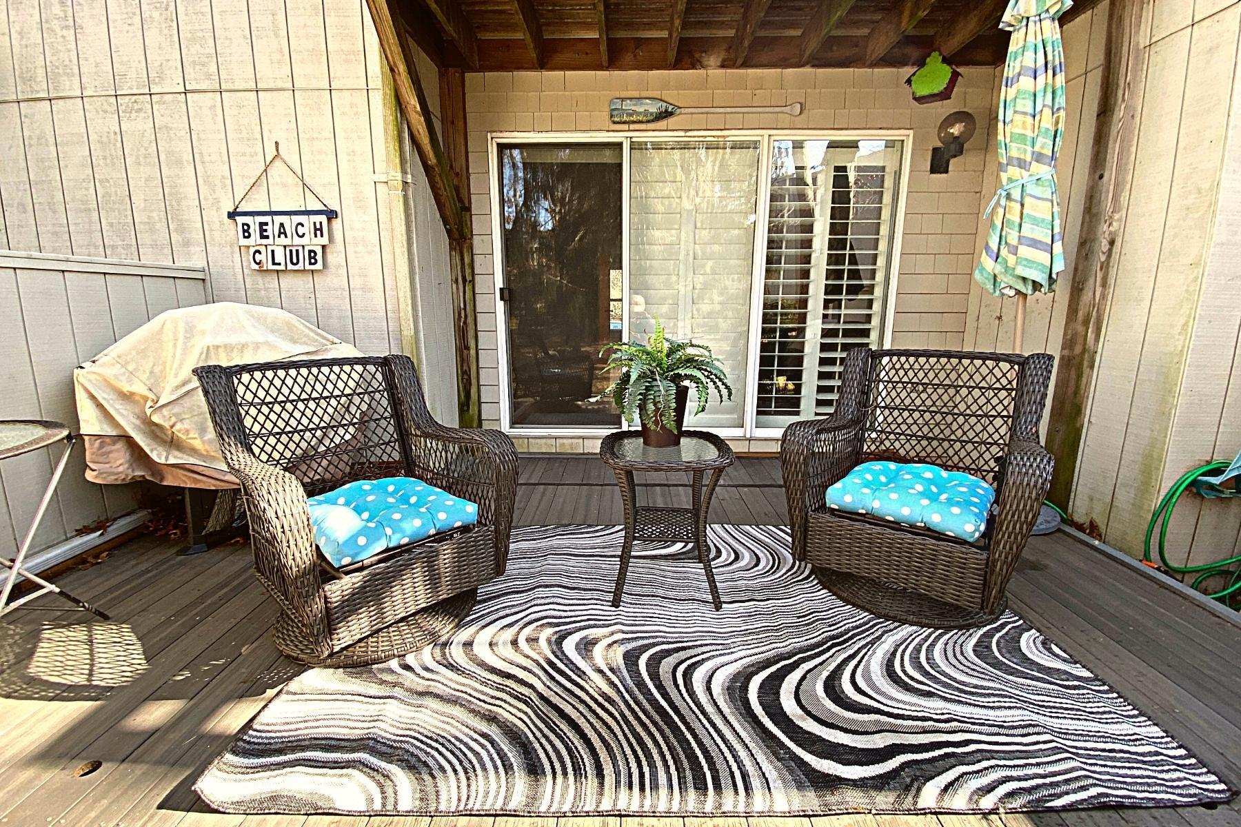 300 Buck Island Road, Unit 7B West Yarmouth, MA 02673 - Photo 20 of 22 a outdoor living space with furniture and a floor to ceiling window