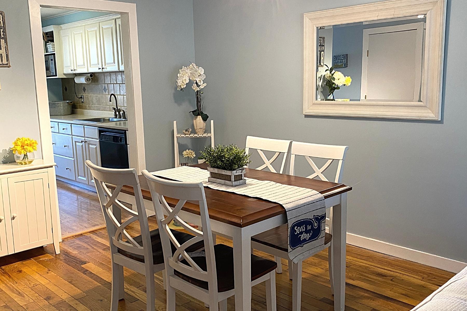 300 Buck Island Road, Unit 7B West Yarmouth, MA 02673 - Photo 10 of 22 a view of a dining room with furniture and wooden floor