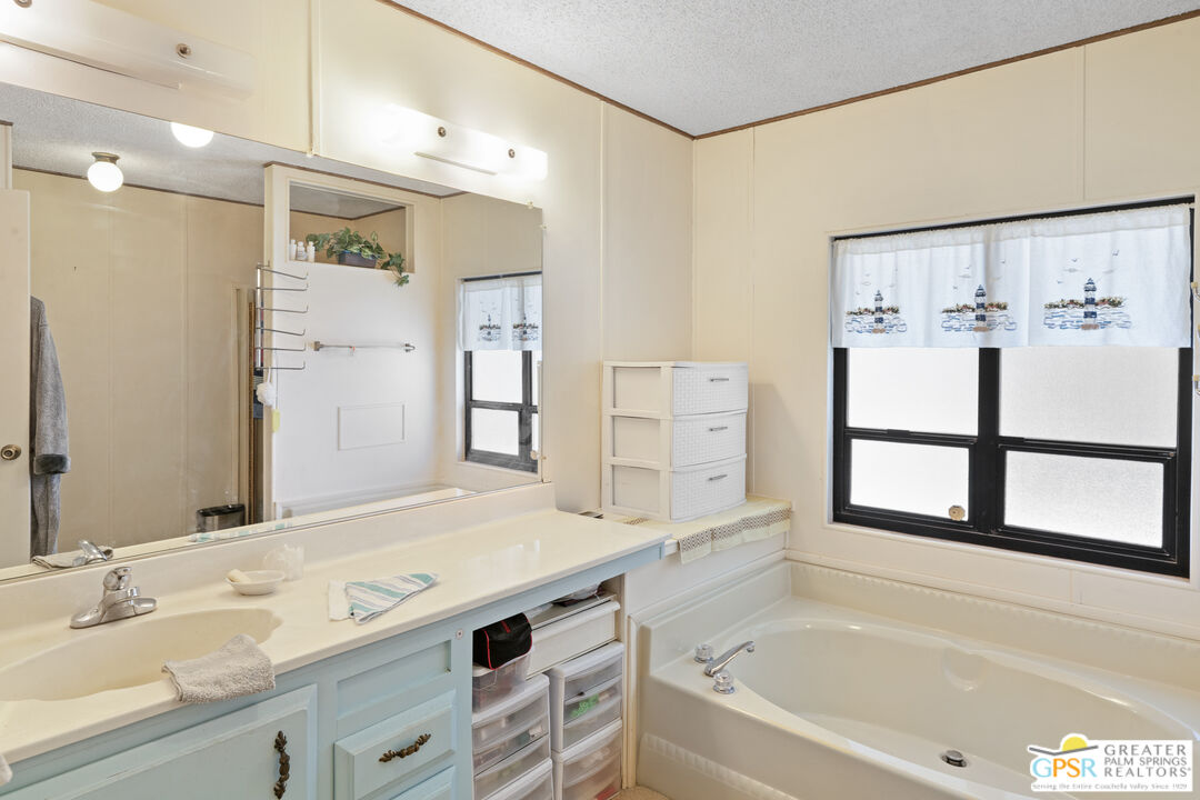 18555 Roberts Road, Unit 103 Desert Hot Springs, CA 92241 - Photo 13 of 30 a bathroom with a bathtub and a sink