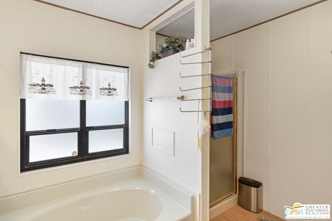 18555 Roberts Road, Unit 103 Desert Hot Springs, CA 92241 - Photo 15 of 30 a bathroom with a bathtub and a shower