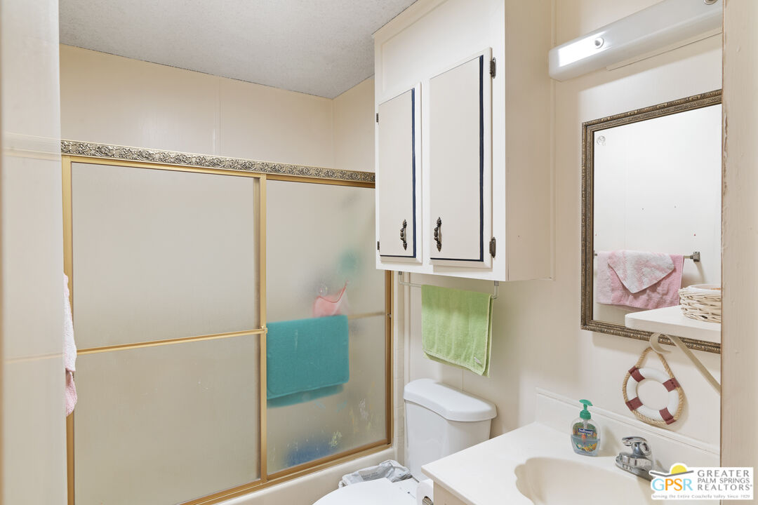 18555 Roberts Road, Unit 103 Desert Hot Springs, CA 92241 - Photo 18 of 30 a bathroom with a sink toilet and shower