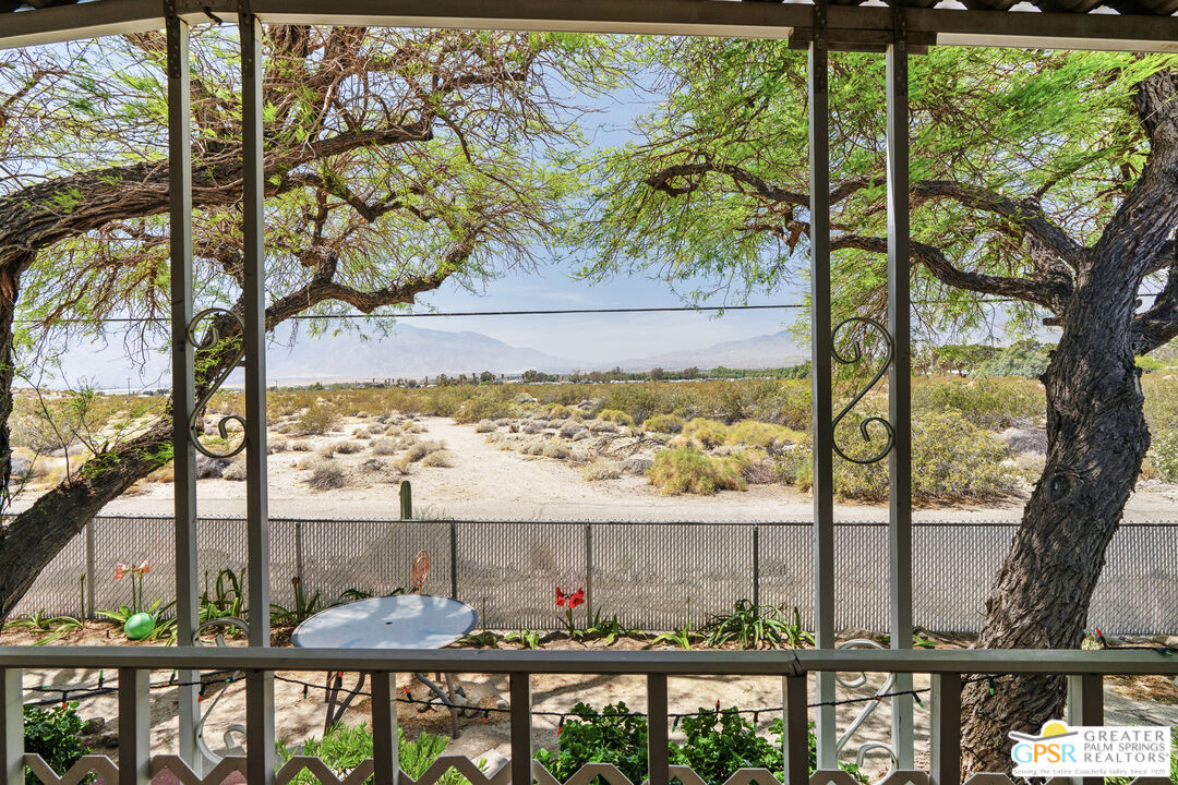 18555 Roberts Road, Unit 103 Desert Hot Springs, CA 92241 - Photo 23 of 30 a view of a chairs and table in patio