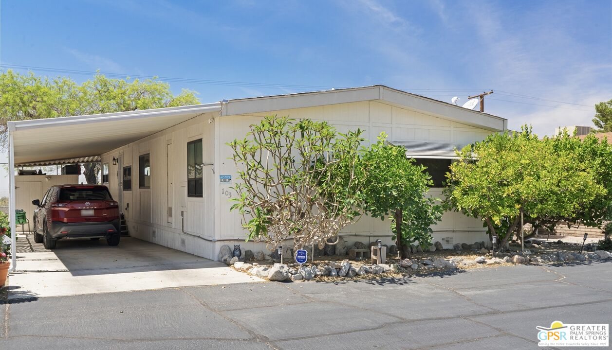 18555 Roberts Road, Unit 103 Desert Hot Springs, CA 92241 - Photo 5 of 30 a view of a car park in front of a building