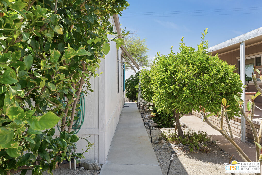 18555 Roberts Road, Unit 103 Desert Hot Springs, CA 92241 - Photo 6 of 30 a view of a pathway in a garden