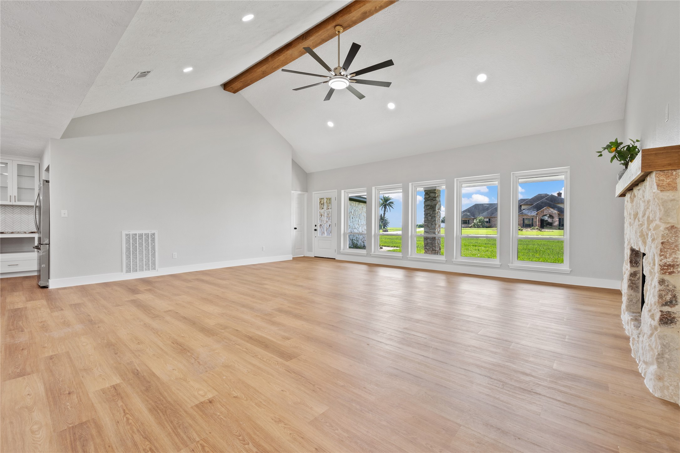 9035 Water Point Drive Beach City, TX 77523 - Photo 11 of 36 a view of an empty room with a window and wooden floor