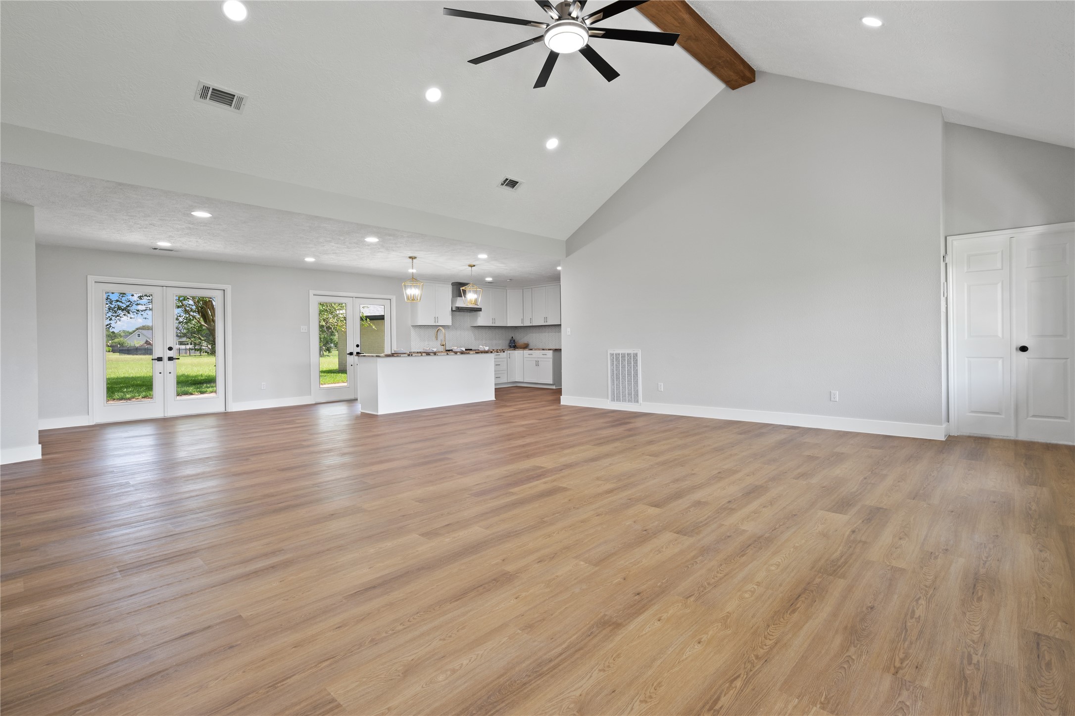9035 Water Point Drive Beach City, TX 77523 - Photo 12 of 36 a view of an empty room with a window and wooden floor