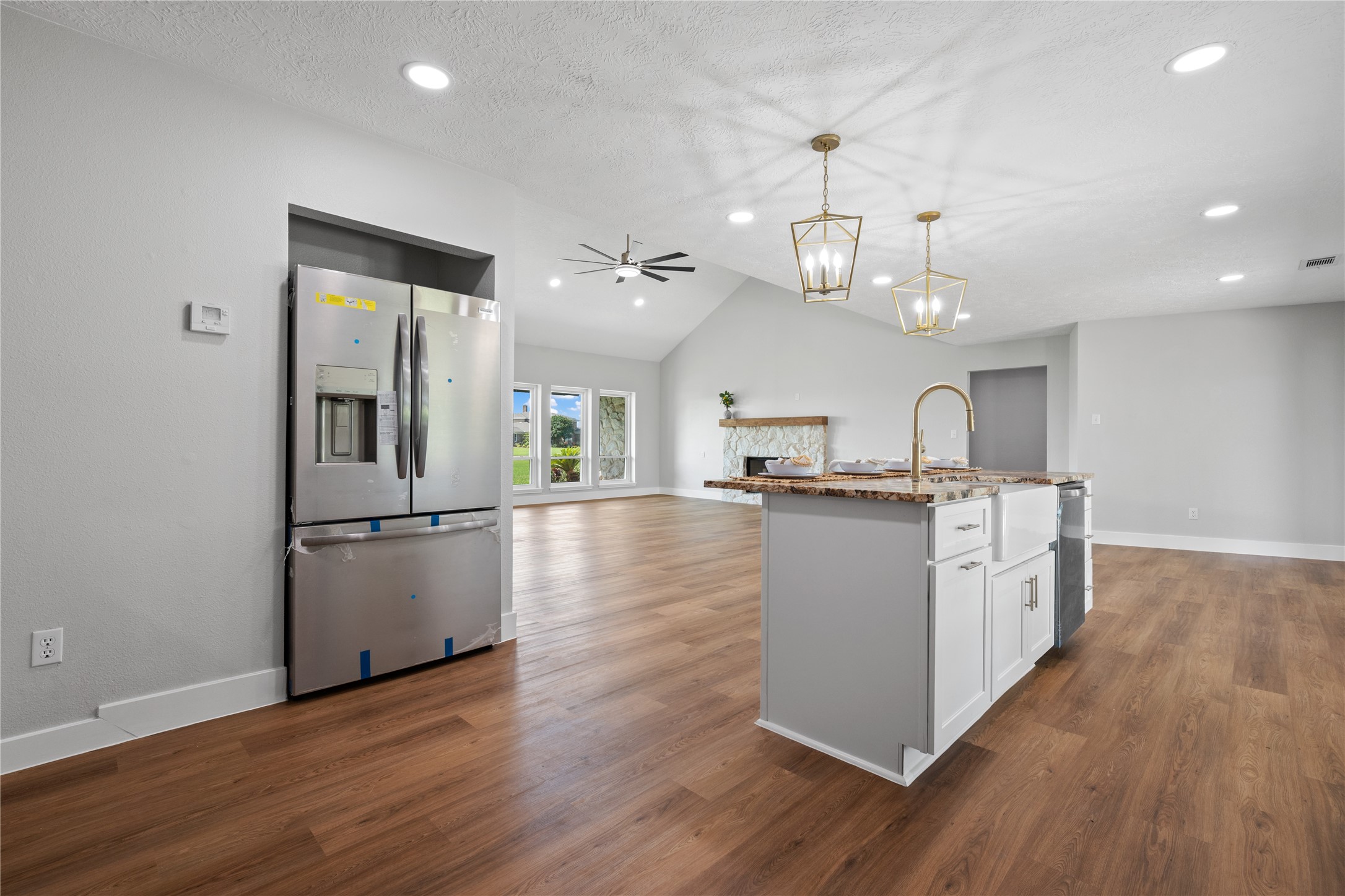 9035 Water Point Drive Beach City, TX 77523 - Photo 18 of 36 an open kitchen with wooden floor and stainless steel appliances