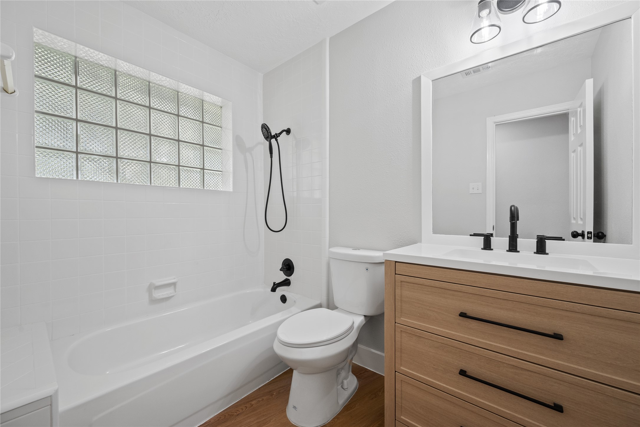 9035 Water Point Drive Beach City, TX 77523 - Photo 20 of 36 a bathroom with a sink a toilet and shower